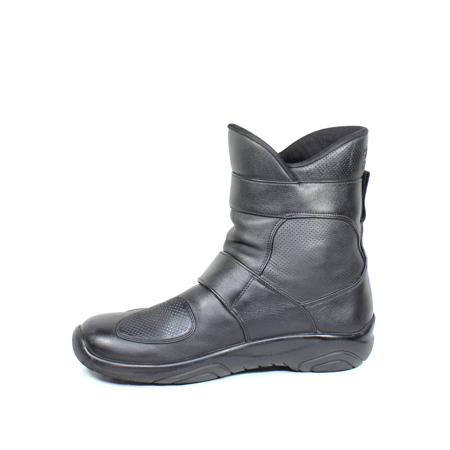 A pair of black leather touring boots, size 41, made in Germany. The boots feature a Gore-Tex membrane for waterproofing and have a high shaft. Key details include ankle protectors on both sides, a reinforced toe box, and a shin protector. The sole is a non-slip rubber with a tire tread pattern. The interior is padded with latex foam for comfort, and the insole is plastic-reinforced with a galvanized steel shank for torsion resistance. Minor wear is visible on the gear lever protection pad and the sole.