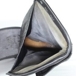 A pair of black leather Gaerne touring boots in size 45. The boots feature protective reinforcements on the toes, shin, ankles, and heels, along with gear and brake lever protection. They are in fairly good condition with some wear marks.