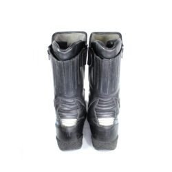 A pair of black leather Gaerne touring boots in size 45. The boots feature protective reinforcements on the toes, shin, ankles, and heels, along with gear and brake lever protection. They are in fairly good condition with some wear marks.