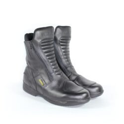 A pair of black leather Hein Gericke Bullson city boots in size 42. The boots feature a Shettex waterproof membrane, reinforced protection on the toes and heel, a reinforced sole, gear lever protection, and reflective elements. They show minor wear marks.