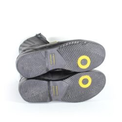 A pair of black leather Hein Gericke Bullson city boots in size 42. The boots feature a Shettex waterproof membrane, reinforced protection on the toes and heel, a reinforced sole, gear lever protection, and reflective elements. They show minor wear marks.