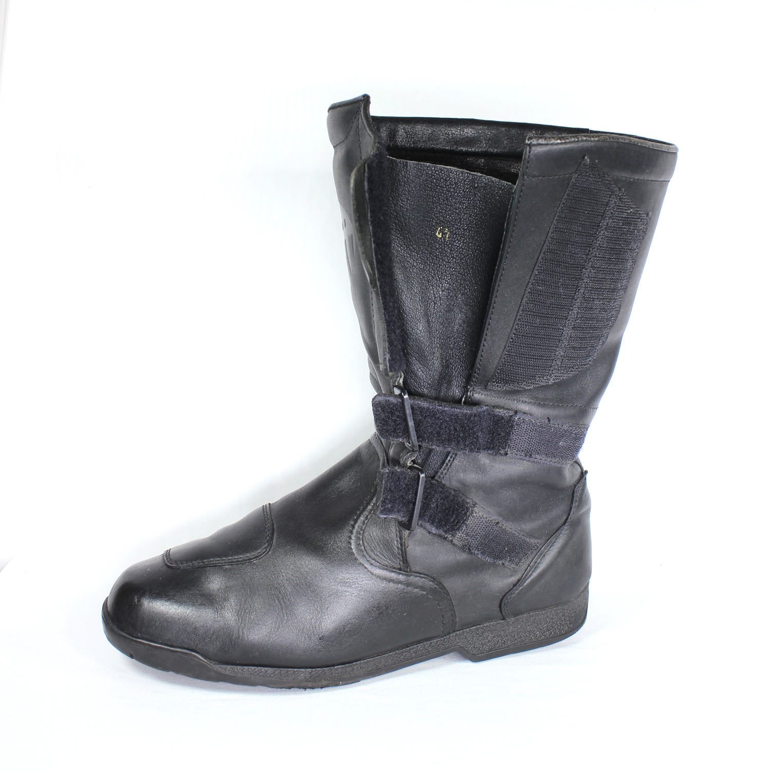 A pair of black leather Hein Gericke Takai touring boots in size 43. The boots feature a Climate waterproof membrane and protective reinforcements on the toes and heel, with gear and brake lever protection. They show some wear marks.