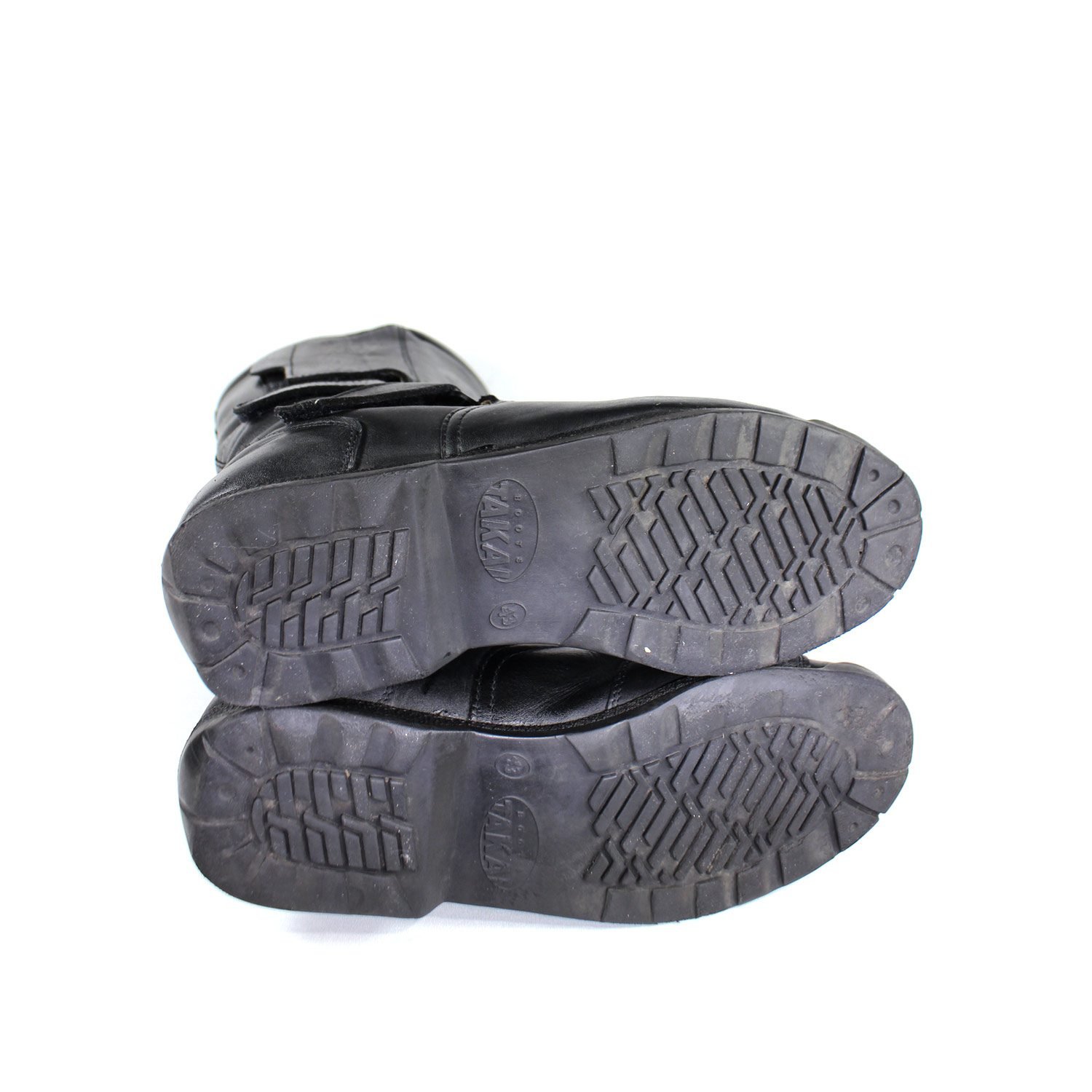 A pair of black leather Hein Gericke Takai touring boots in size 43. The boots feature a Climate waterproof membrane and protective reinforcements on the toes and heel, with gear and brake lever protection. They show some wear marks.