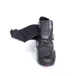 A pair of black leather Hein Gericke "Walk and Ride" street boots in size 41. The boots feature a Climate waterproof membrane, protection for the toes, shin, and heels, a reinforced sole, and rear reflectors. They show some wear marks, including a small break in the plastic brake lever protector.