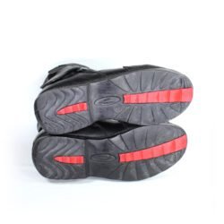 A pair of black leather Hein Gericke "Walk and Ride" street boots in size 41. The boots feature a Climate waterproof membrane, protection for the toes, shin, and heels, a reinforced sole, and rear reflectors. They show some wear marks, including a small break in the plastic brake lever protector.