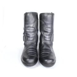 A pair of black leather Kochmann touring boots in size 41. The boots feature a SympaTex waterproof membrane and protective reinforcements on the toes, heels, ankles, and a reinforced sole with gear and brake lever protection. They show minor wear marks.