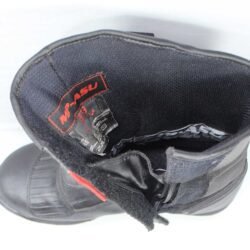 A pair of black leather MC MP-ASU Caronte touring boots in size 39. The boots feature protective reinforcements on the toes, shin, ankles, and heel, with a reinforced sole and gear/brake lever protection. They are in fairly good condition with some wear marks and are no longer waterproof.