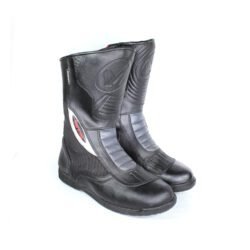 A pair of black leather MC MP-ASU Caronte touring boots in size 39. The boots feature protective reinforcements on the toes, shin, ankles, and heel, with a reinforced sole and gear/brake lever protection. They are in fairly good condition with some wear marks and are no longer waterproof.