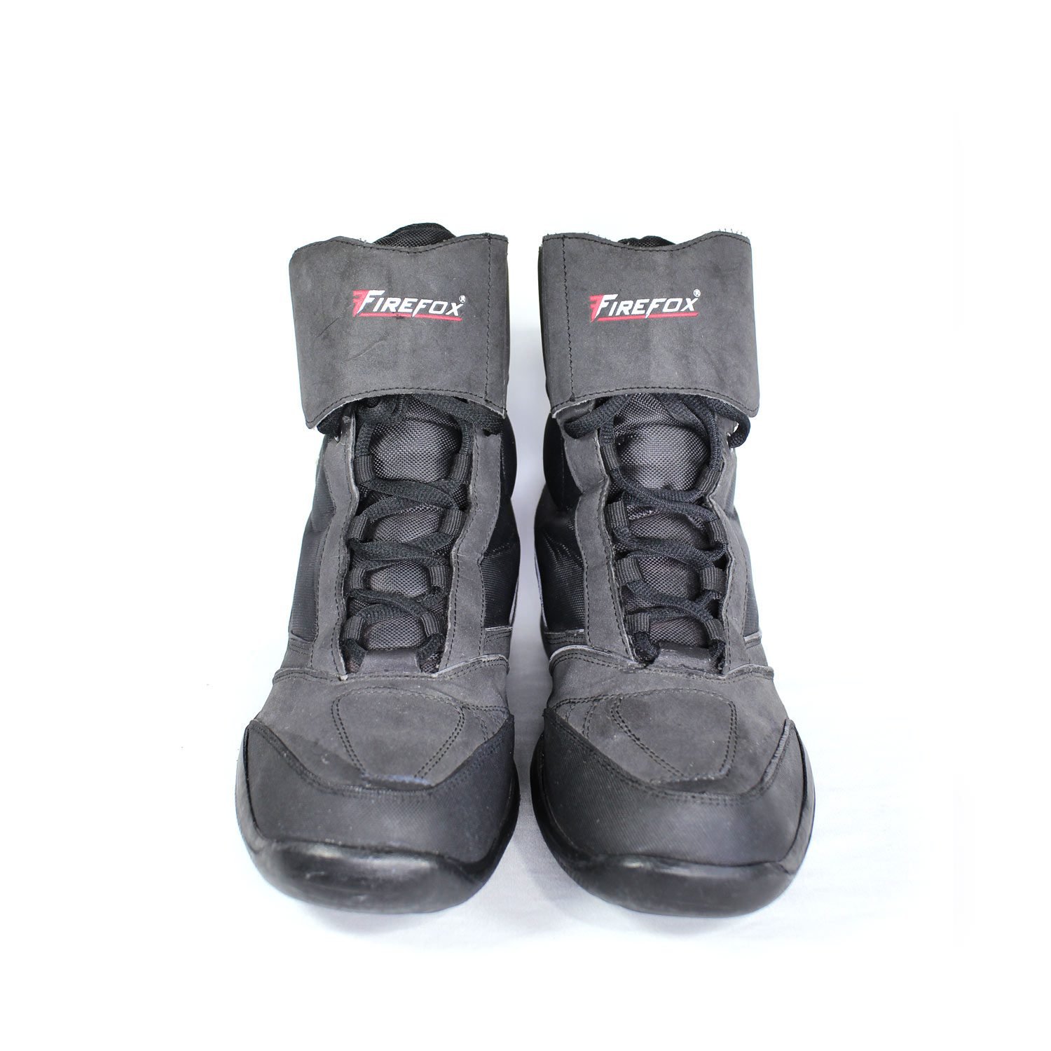 A pair of dark grey Polo Firefox city boots in size 41, made of synthetic suede leather. The boots feature protective reinforcements on the toes, ankles, and heels, along with a reinforced sole and gear/brake lever protection. They show some wear marks.