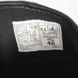 Black leather and textile touring boots in size 46, in like-new condition. Features protection for the toes, shin, ankles, and heel.