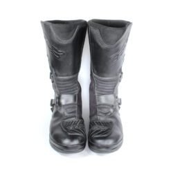 A pair of black TCX Infinity Evo GTX adventure touring boots in size 43, made of leather. They feature a Gore-Tex waterproof membrane, a Michelin® adventure rubber sole, two adjustable aluminum buckles, and extensive protection for the toes, shin, ankles, and heels. The boots are in very good condition with minor wear marks.
