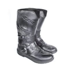 A pair of black TCX Infinity Evo GTX adventure touring boots in size 43, made of leather. They feature a Gore-Tex waterproof membrane, a Michelin® adventure rubber sole, two adjustable aluminum buckles, and extensive protection for the toes, shin, ankles, and heels. The boots are in very good condition with minor wear marks.