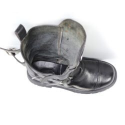 A pair of black leather Chopper-style cruiser boots by Underground Shoes in size 39. The boots feature a classic English design with metallic hardware accents and protective reinforcements on the toe, shin, and heel. They are in very good condition with minor wear marks.