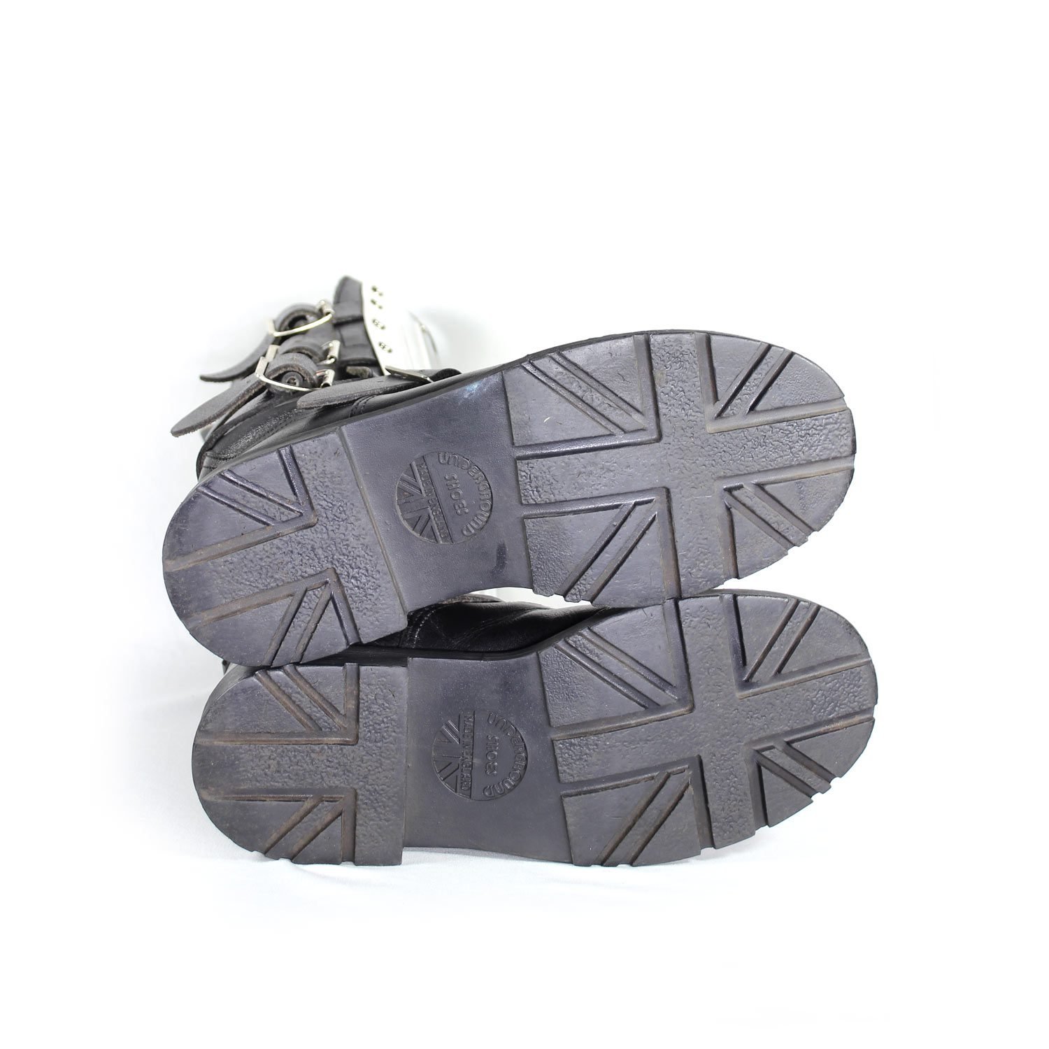 A pair of black leather Chopper-style cruiser boots by Underground Shoes in size 39. The boots feature a classic English design with metallic hardware accents and protective reinforcements on the toe, shin, and heel. They are in very good condition with minor wear marks.