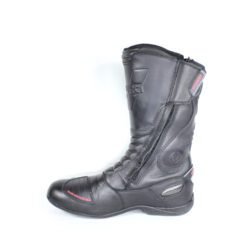 A pair of black Vanucci VTB touring boots in size 44, made of nappa leather. They feature a SympaTex membrane, two side zippers, a tall shaft, and protection including a wide shin guard, carbon side inserts, and reinforced ankles, toes, and heel. The boots show wear marks and the rear reflectors have lost their reflectivity.