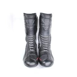 A pair of black Vanucci VTB touring boots in size 44, made of nappa leather. They feature a SympaTex membrane, two side zippers, a tall shaft, and protection including a wide shin guard, carbon side inserts, and reinforced ankles, toes, and heel. The boots show wear marks and the rear reflectors have lost their reflectivity.