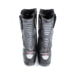 A pair of black Vanucci VTB touring boots in size 44, made of nappa leather. They feature a SympaTex membrane, two side zippers, a tall shaft, and protection including a wide shin guard, carbon side inserts, and reinforced ankles, toes, and heel. The boots show wear marks and the rear reflectors have lost their reflectivity.