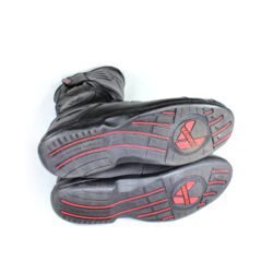 A pair of black Vanucci VTB touring boots in size 44, made of nappa leather. They feature a SympaTex membrane, two side zippers, a tall shaft, and protection including a wide shin guard, carbon side inserts, and reinforced ankles, toes, and heel. The boots show wear marks and the rear reflectors have lost their reflectivity.