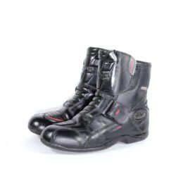 A pair of black Vanucci VTB4 short touring boots in size 41, made of nappa leather. They feature carbon fiber side panels, a Sympatex waterproof membrane, and protective reinforcements on the toes, shin, ankles, and heel. The boots show some wear marks.