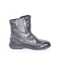 A pair of black Vanucci VTB4 short touring boots in size 41, made of nappa leather. They feature carbon fiber side panels, a Sympatex waterproof membrane, and protective reinforcements on the toes, shin, ankles, and heel. The boots show some wear marks.