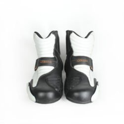 A pair of black and white Alpinestars S-MX 1.1 KTM Powerwear boots, size 44, in like-new condition. Features lightweight leather construction, accordion flex zones for walking, TPU ankle sliders, a grippy sole, and protection for the toes, heel, and shift area.