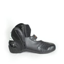 A pair of black and white Alpinestars S-MX 1.1 KTM Powerwear boots, size 44, in like-new condition. Features lightweight leather construction, accordion flex zones for walking, TPU ankle sliders, a grippy sole, and protection for the toes, heel, and shift area.