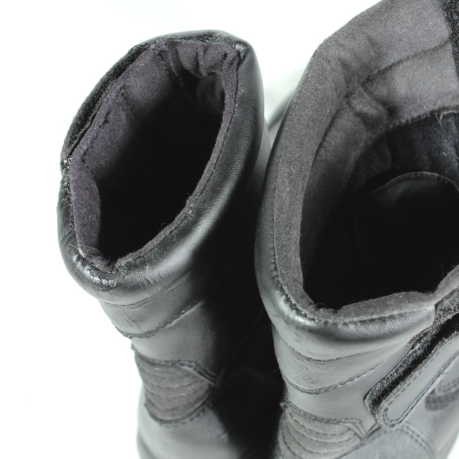 A pair of black synthetic leather motorcycle boots, size 37, in fair condition. Features typical touring and street styling with protection for the toes, heel, shin, and sole. Shows signs of aging, including cracks and wrinkles on the PU-leather.