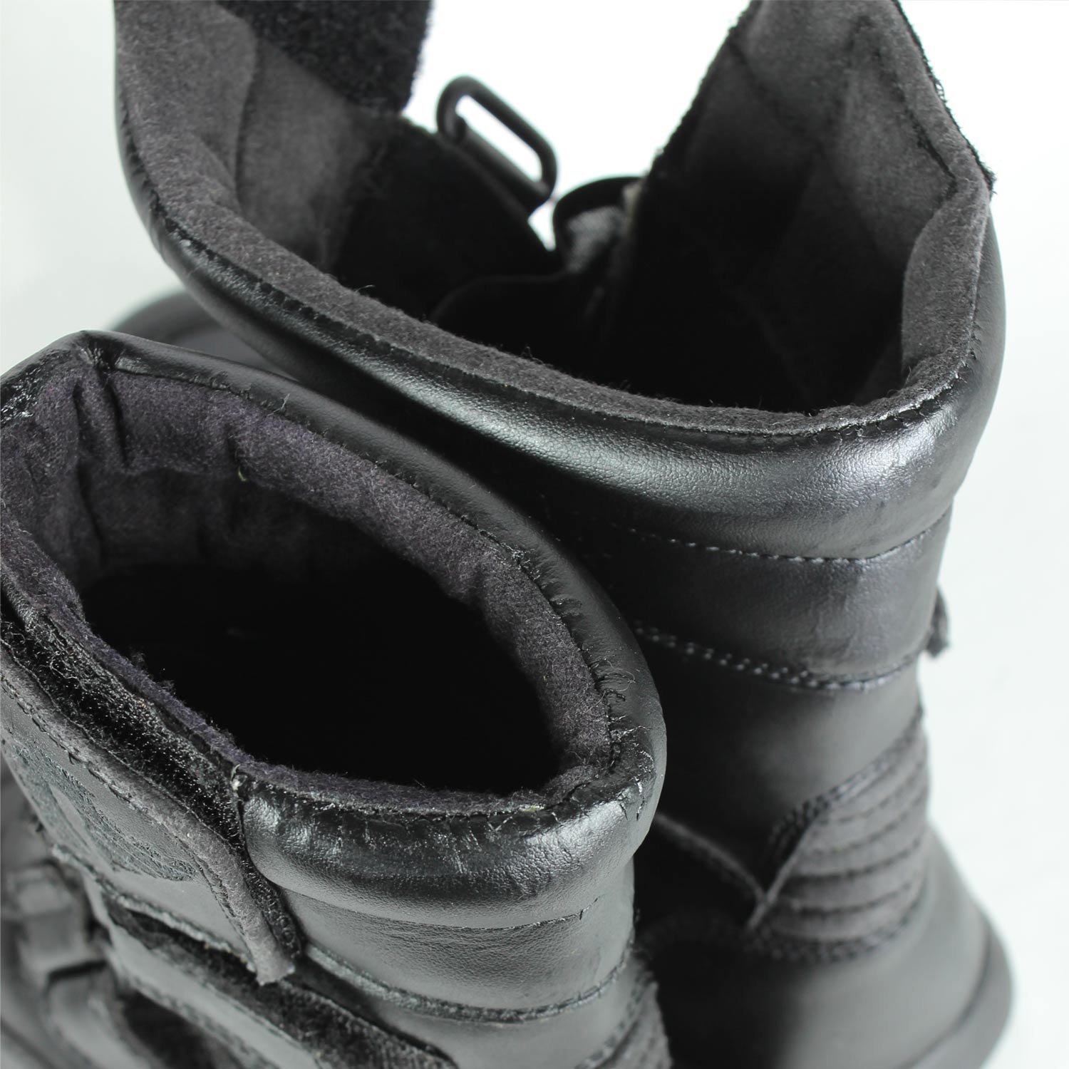 A pair of black synthetic leather motorcycle boots, size 37, in fair condition. Features typical touring and street styling with protection for the toes, heel, shin, and sole. Shows signs of aging, including cracks and wrinkles on the PU-leather.