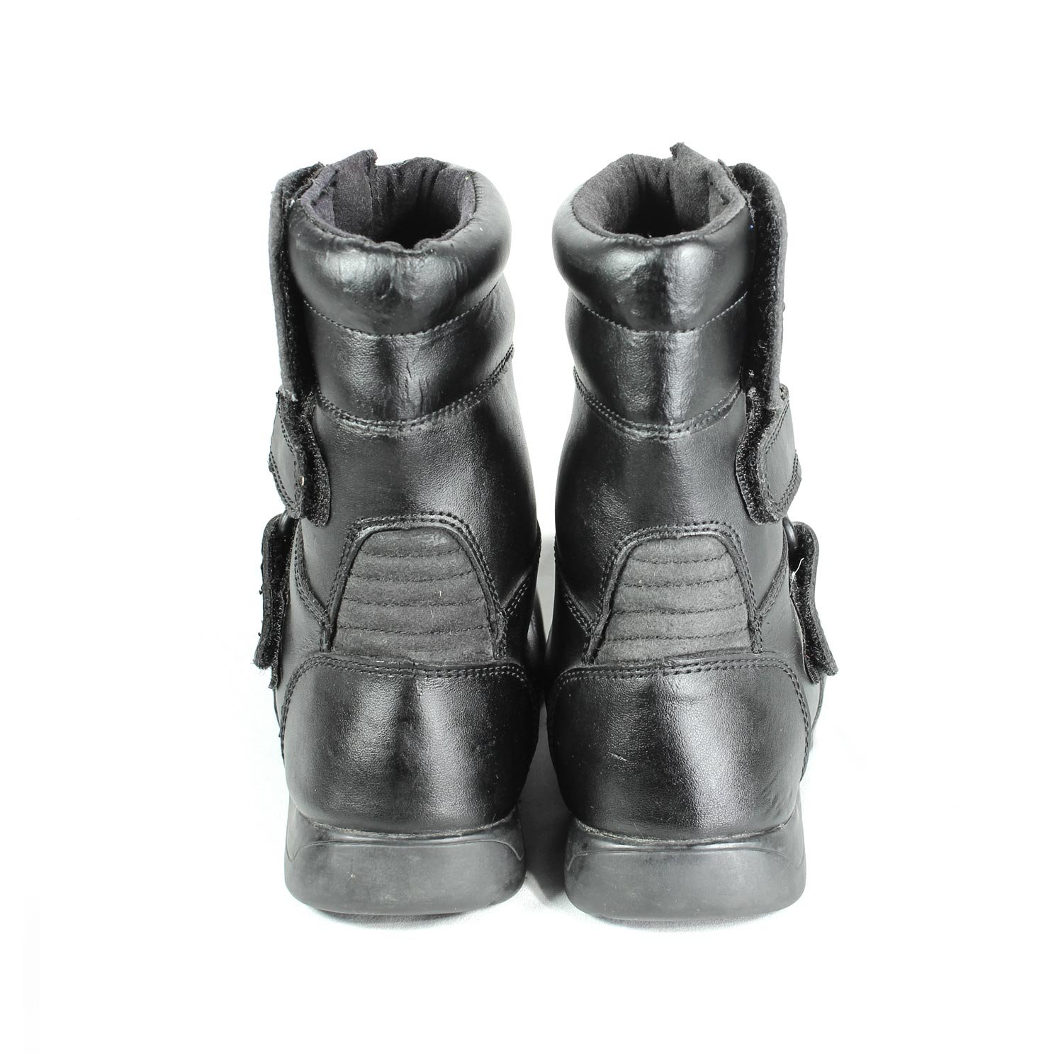 A pair of black synthetic leather motorcycle boots, size 37, in fair condition. Features typical touring and street styling with protection for the toes, heel, shin, and sole. Shows signs of aging, including cracks and wrinkles on the PU-leather.