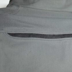 A grey Dainese waterproof textile motorcycle jacket, size 54, in very good condition. Features CE-rated shoulder and elbow armor, D-Dry membrane, high ventilation mesh, and a street or city style.