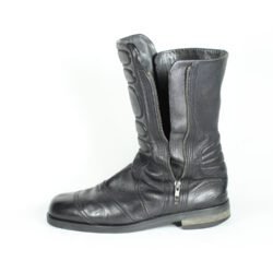 A pair of black Hugo Boss high-quality leather boots, size 47, in good condition. Features a classic, rugged cruiser-style look suitable for motorcycle riding. Made from durable leather with typical minor wear marks and wrinkles.