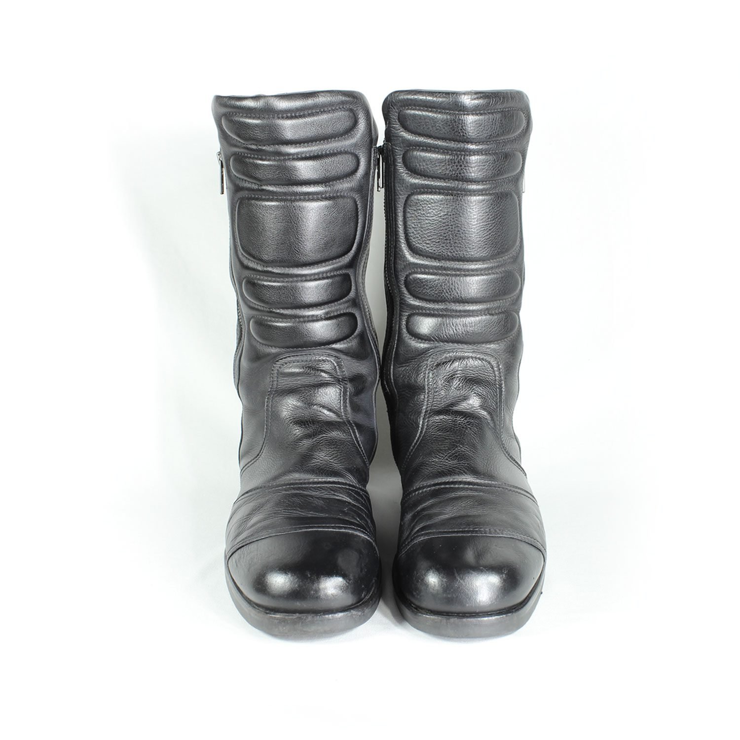 A pair of black Hugo Boss high-quality leather boots, size 47, in good condition. Features a classic, rugged cruiser-style look suitable for motorcycle riding. Made from durable leather with typical minor wear marks and wrinkles.