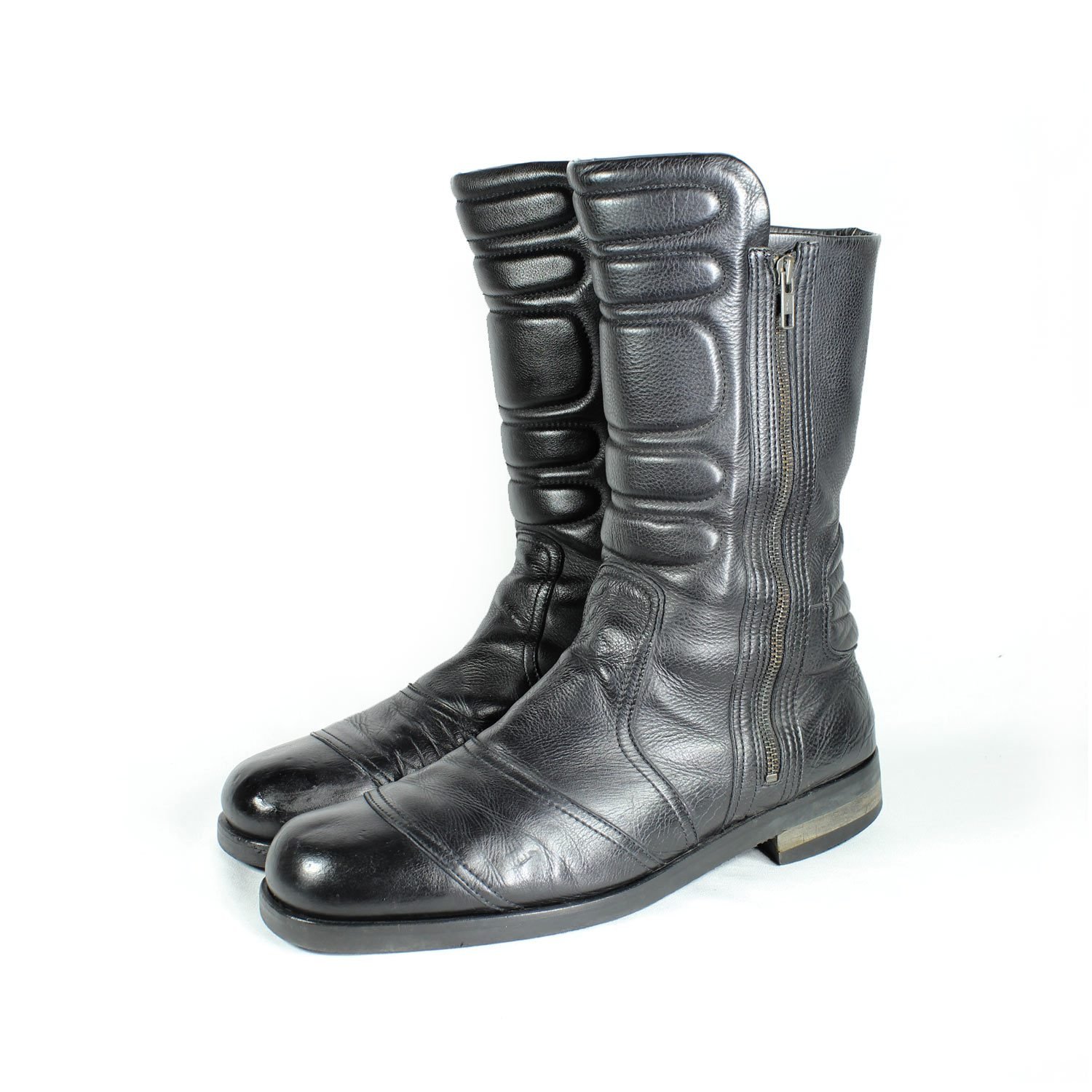 A pair of black Hugo Boss high-quality leather boots, size 47, in good condition. Features a classic, rugged cruiser-style look suitable for motorcycle riding. Made from durable leather with typical minor wear marks and wrinkles.