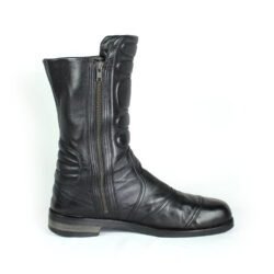 A pair of black Hugo Boss high-quality leather boots, size 47, in good condition. Features a classic, rugged cruiser-style look suitable for motorcycle riding. Made from durable leather with typical minor wear marks and wrinkles.