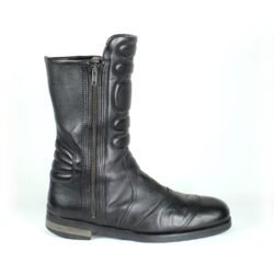 A pair of black Hugo Boss high-quality leather boots, size 47, in good condition. Features a classic, rugged cruiser-style look suitable for motorcycle riding. Made from durable leather with typical minor wear marks and wrinkles.