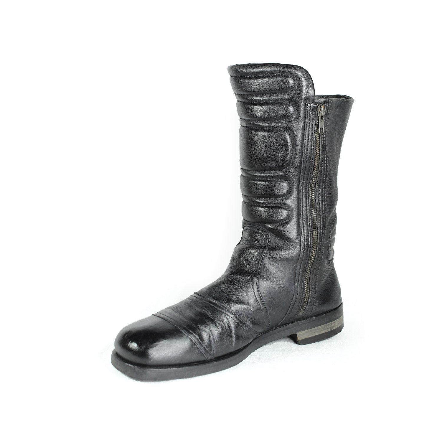 A pair of black Hugo Boss high-quality leather boots, size 47, in good condition. Features a classic, rugged cruiser-style look suitable for motorcycle riding. Made from durable leather with typical minor wear marks and wrinkles.