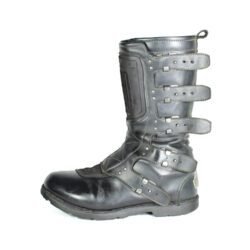 A pair of black ICON ONE THOUSAND 12" full-grain leather motorcycle boots, size 47, in good condition. Features ankle armor, reinforced shifter and shin protection, water-repellent leather, and a Goodyear welt construction. Shows typical wear, a missing screw on a back plaque, and a minor buckle flaw that does not hinder function.