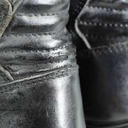 A pair of black Louis street riding boots, size 40/41, in good condition. Made of durable leather with essential impact protection for the toes, heel, and around the gear and brake levers. Shows typical leather wrinkles and some wear marks.