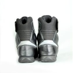 A pair of black Polo street riding boots, size 43, in good condition with minor wear marks and leather wrinkles. Features durable leather and textile construction, a PoloTex waterproof membrane, integrated reflective stripes, and reinforced impact protection for toes, ankles, and sole.