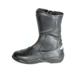 A pair of black Polo touring motorcycle boots, size 39, in very good condition. Made of full-grain leather with a PoloTex waterproof membrane, anti-slip sole, integrated reflective stripes, and comprehensive protection for the shin, ankles, heel, and toes