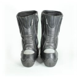 A pair of black Polo touring motorcycle boots, size 39, in very good condition. Made of full-grain leather with a PoloTex waterproof membrane, anti-slip sole, integrated reflective stripes, and comprehensive protection for the shin, ankles, heel, and toes