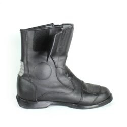 A pair of black Polo touring motorcycle boots, size 42, in good condition. Made of synthetic leather with waterproofing, featuring protection for toes, shin, ankles, heel, and a reinforced sole. Shows minor wear and wrinkles.