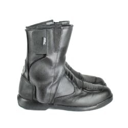 A pair of black Polo touring motorcycle boots, size 42, in good condition. Made of synthetic leather with waterproofing, featuring protection for toes, shin, ankles, heel, and a reinforced sole. Shows minor wear and wrinkles.