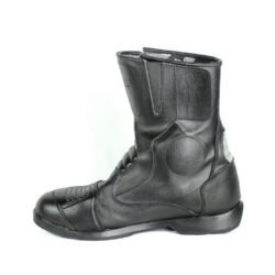 A pair of black Polo touring motorcycle boots, size 42, in good condition. Made of synthetic leather with waterproofing, featuring protection for toes, shin, ankles, heel, and a reinforced sole. Shows minor wear and wrinkles.