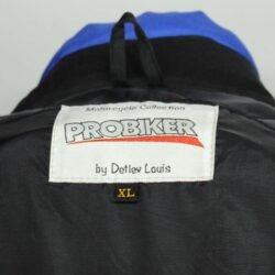 A Probiker touring and street motorcycle jacket, size XL, in very good condition. Features a classic black and blue textile design, with integrated protection for elbows, shoulders, and back, suitable for fair weather riding.