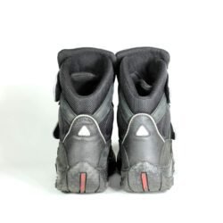 A pair of black REDBIKE lightweight short motorcycle boots, size 42, in good condition. Made of waterproof nubuck leather and textile with a HIPORA membrane, featuring ABS ankle protectors, a reinforced sole, and an antibacterial removable insole for urban riding.