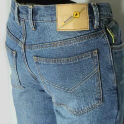 A pair of blue Bering motorcycle jeans, size M (84 cm waist), in like-new condition. Features a straight-cut casual denim style with a cotton shell and a Kevlar-blend lining for abrasion resistance, plus integrated knee protectors.
