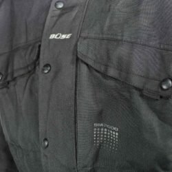 A black Büse touring and street motorcycle jacket, size 3XL, in good condition. Made of textile with multiple adjustment points for fit and CE protectors for shoulders, elbows, and back