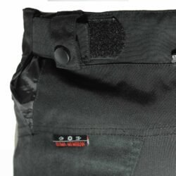 A pair of black DXR waterproof textile motorcycle pants, size M (48/50, 85 cm waist), in very good condition. Features a Klima-Membrane for all-weather touring, knee protectors, reflectors, waist adjustment, and a short jacket connection zipper.