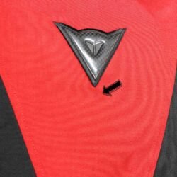 A black and red Dainese Moto Collection touring jacket, size 54, in very good condition. Features versatile styling with detachable sleeves, full-length ventilation, a thermal liner, multiple pockets, and CE protection for shoulders, elbows, and back.